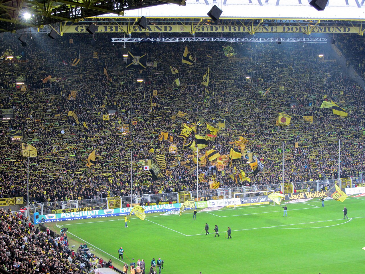 The interior of Signal Iduna Park in Dortmund, packed with supporters, seen from across the pitch